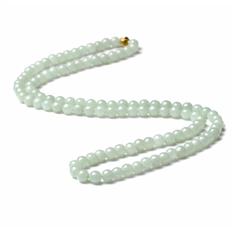 Adjustable length natural jade bead necklace with white and green round beads on a chain.