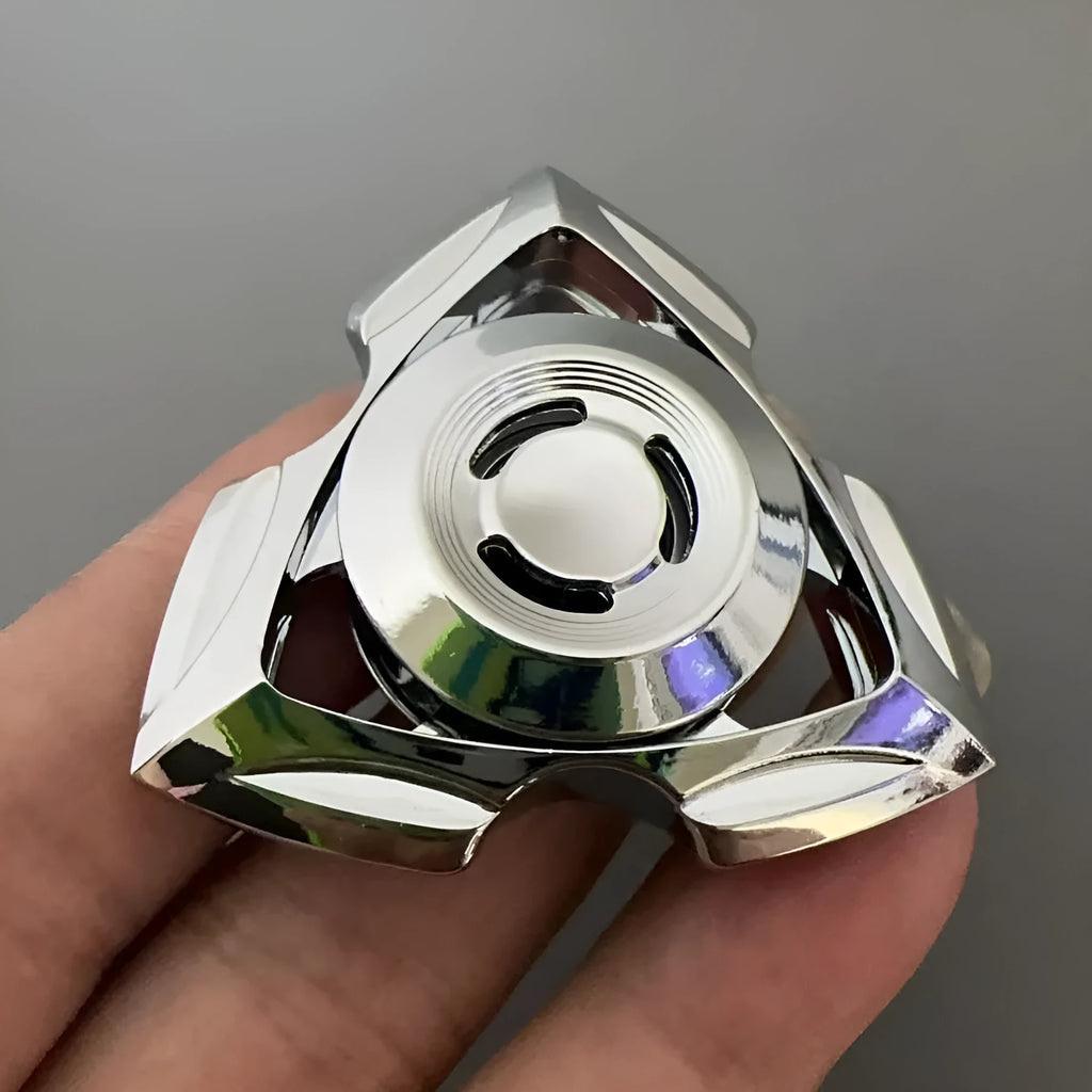 A silver and colourful alloy metal fingertip gyro decompression spinner toy.