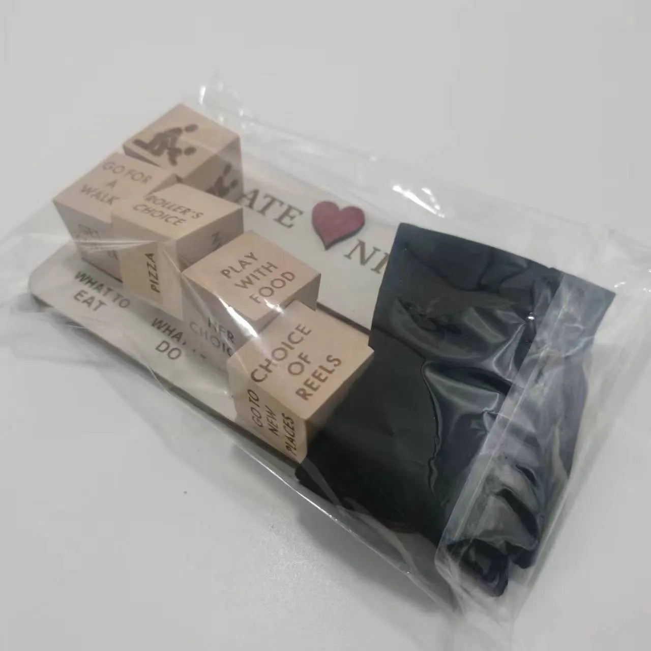 Wooden date night dice set with five natural wood dice, date planner board, and black storage bag for couple games