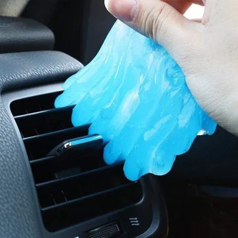 Blue and yellow Magic Cleaning Gel blocks, a reusable 160g adhesive putty for dust removal.