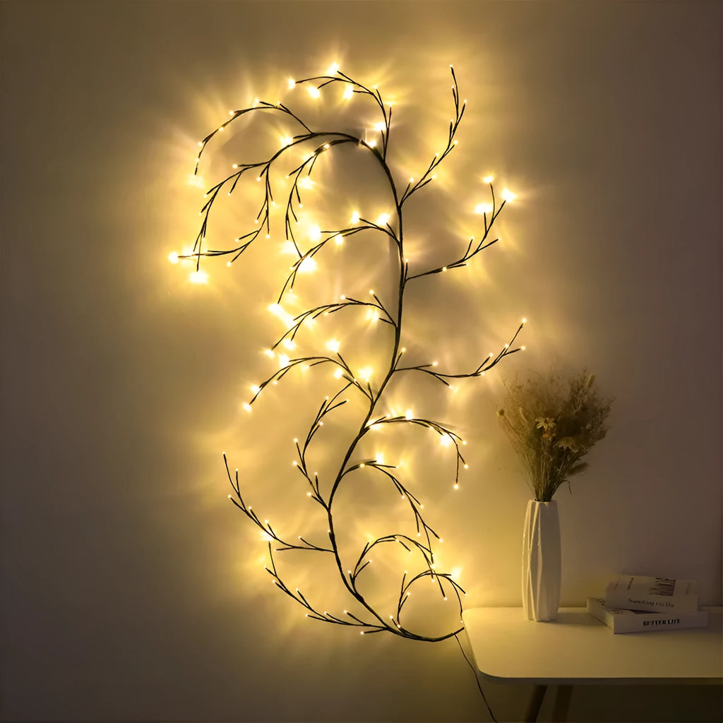 Warm white LED tree decorative light with rattan-style string and choice of plug type.
