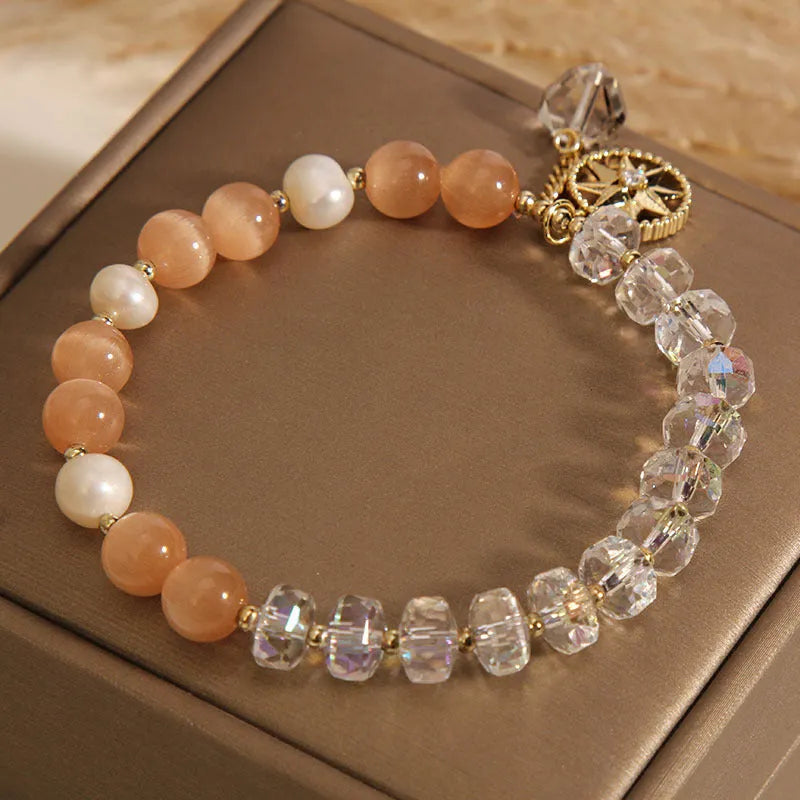 Orange women's bracelet with eight Awn star design and gold-plated inlaid stone.