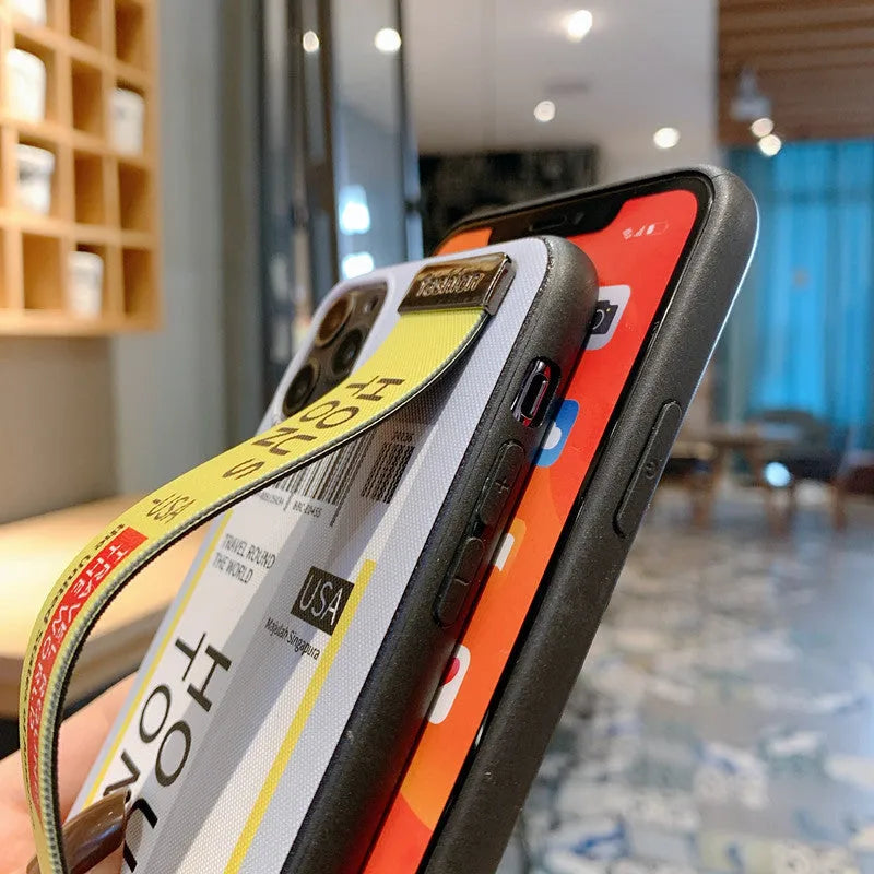 Red TPU and PC mobile phone case for Apple iPhone with attached wristband.