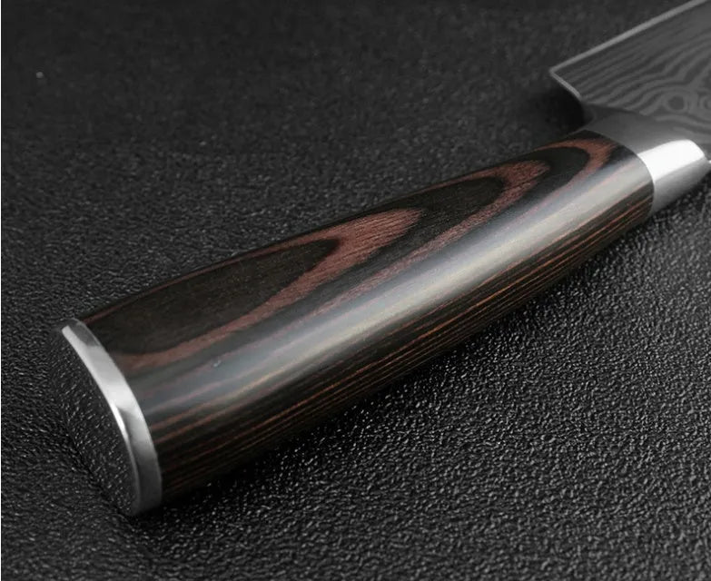 Kitchen knife set with Damascus pattern blades and coloured wood handles on display