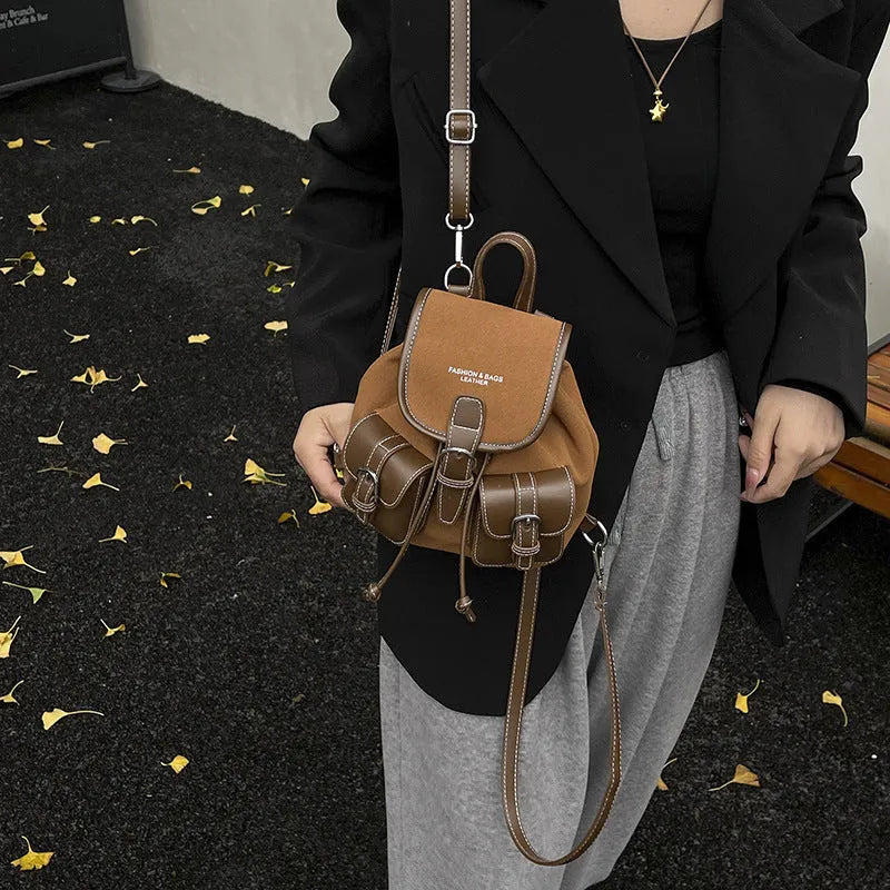 Urban simplicity backpack in black with clamshell opening and contrast stitching on front