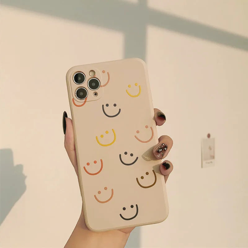 Silicone TPU phone case with painted smiley design for iPhone, shown in rainbow colour.