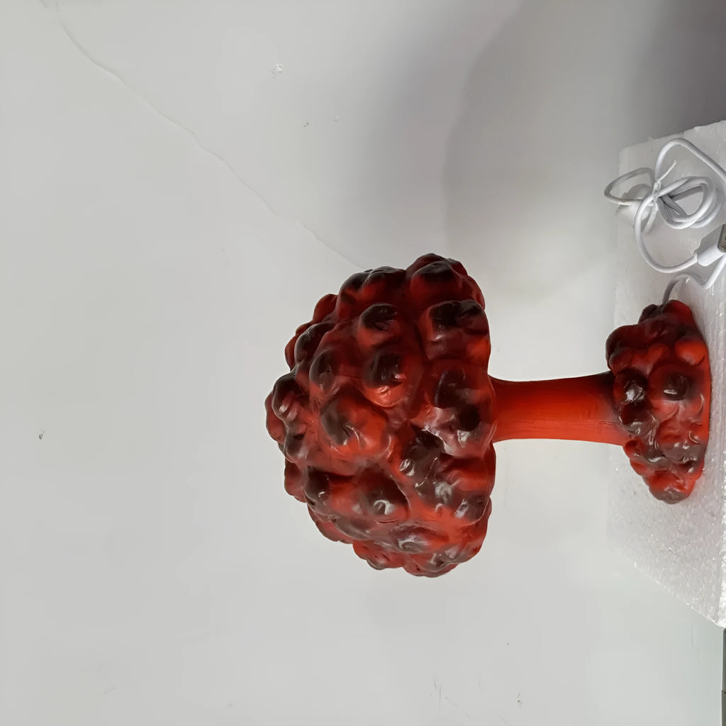Modern art table lamp shaped like an atomic bomb mushroom cloud on a stand with USB cable.