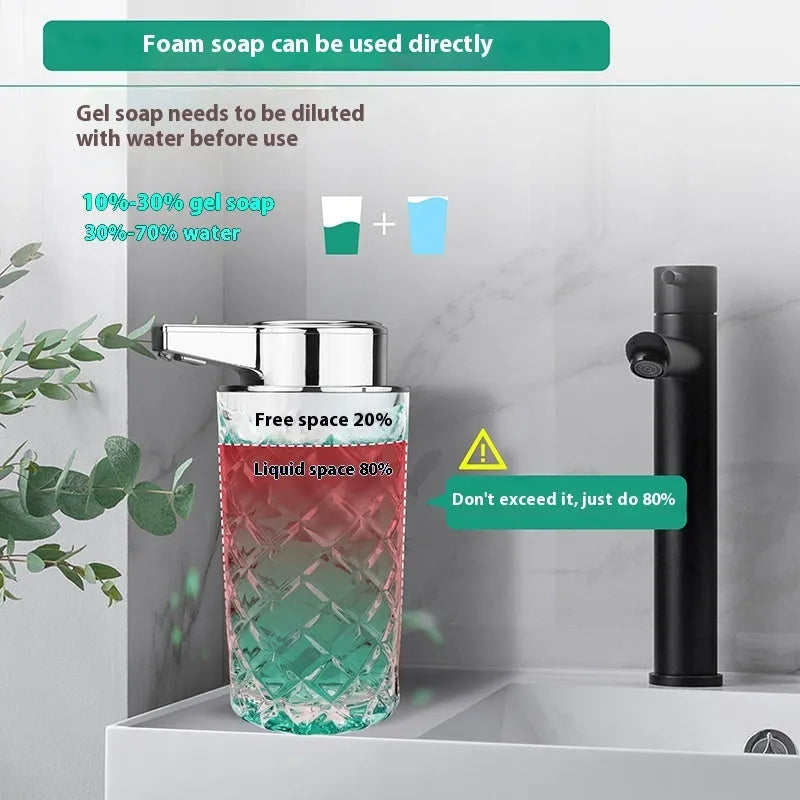 Silver automatic soap dispenser with sensor and USB-C charging port on a bathroom countertop