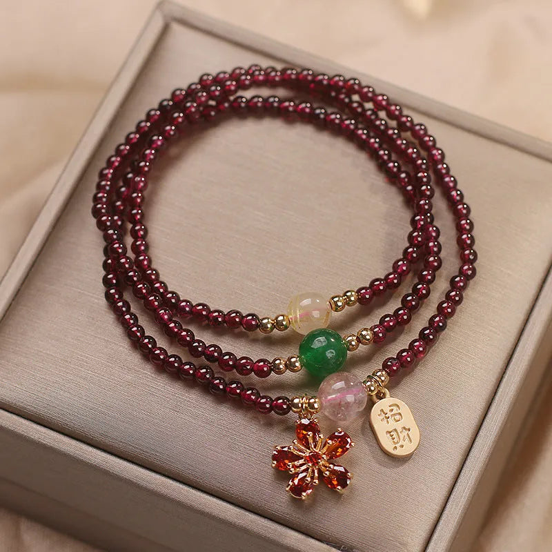 Natural crystal women's bracelet in pomegranate red cherry blossom colour with sequin detail