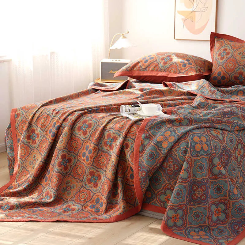 Cotton gauze bed blanket three-piece set with floral pattern showing blanket and two matching pillowcases