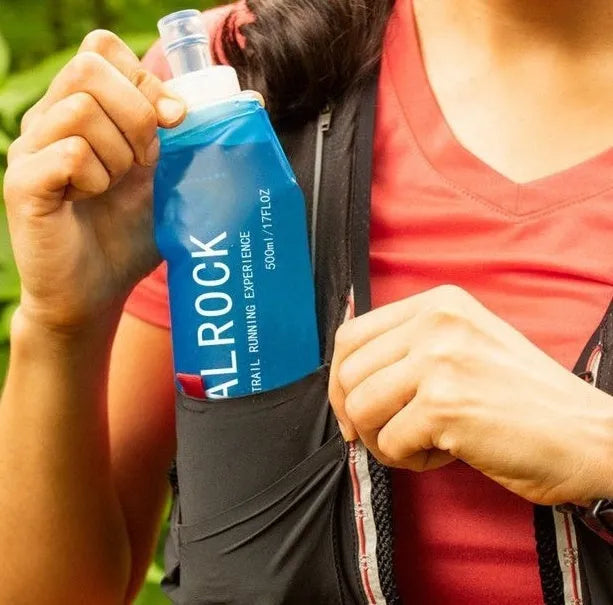Portable plastic drinking straw with suction tube for outdoor hydration during mountain biking.