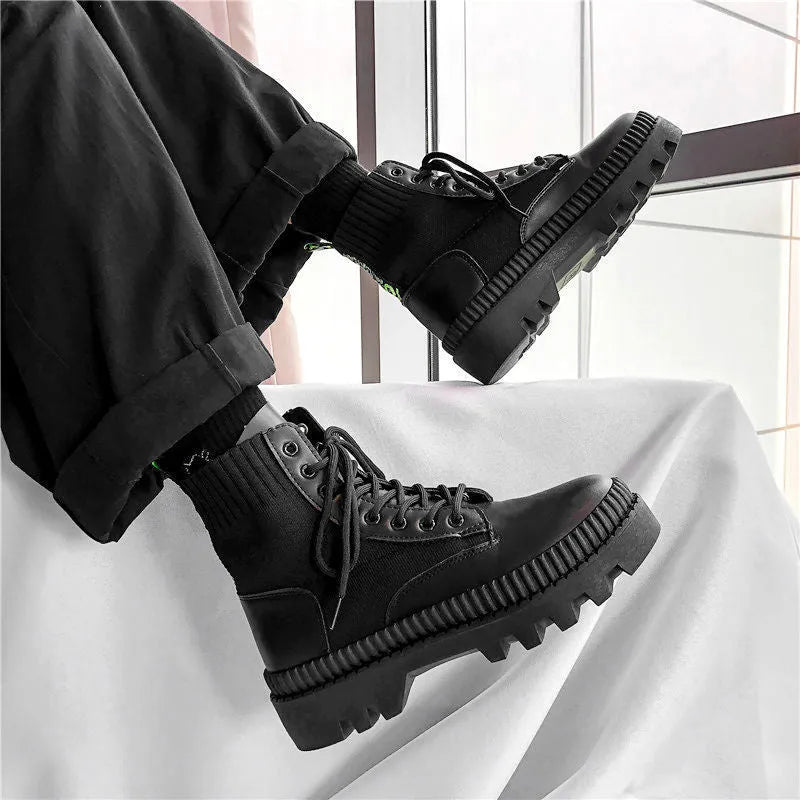 Black frosted leather Dr Martens boots with white laces and a side zipper on a high-top 8-hole design.