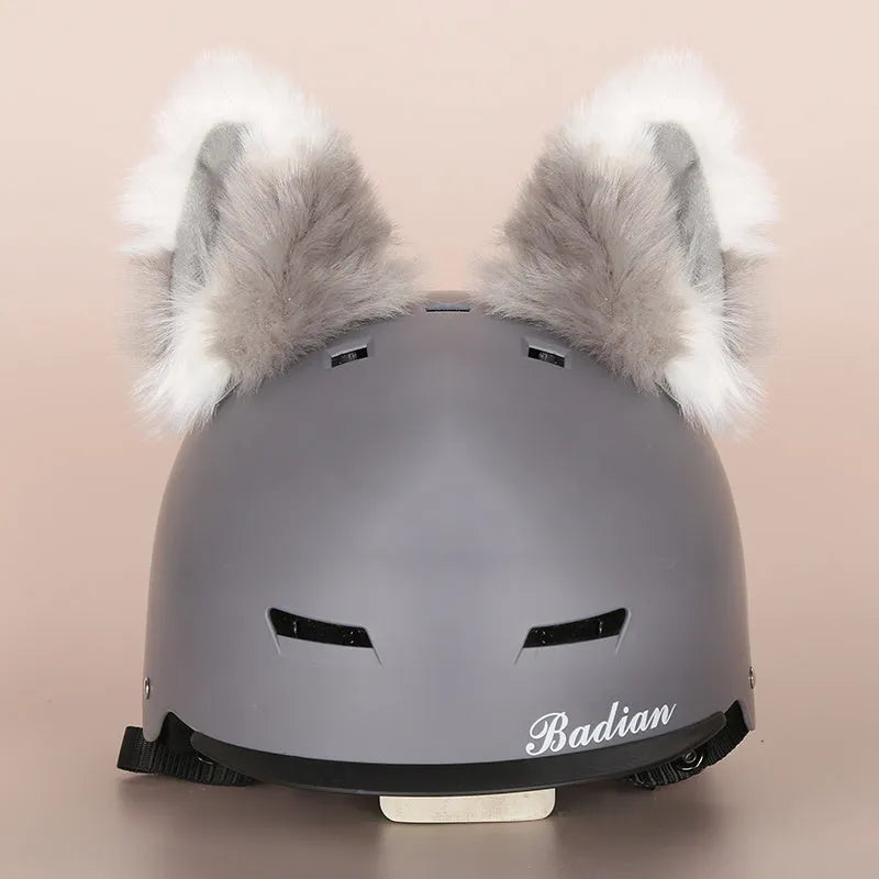Soft plush cartoon character cover on a motorcycle helmet, showing size M and decorative ear sections.