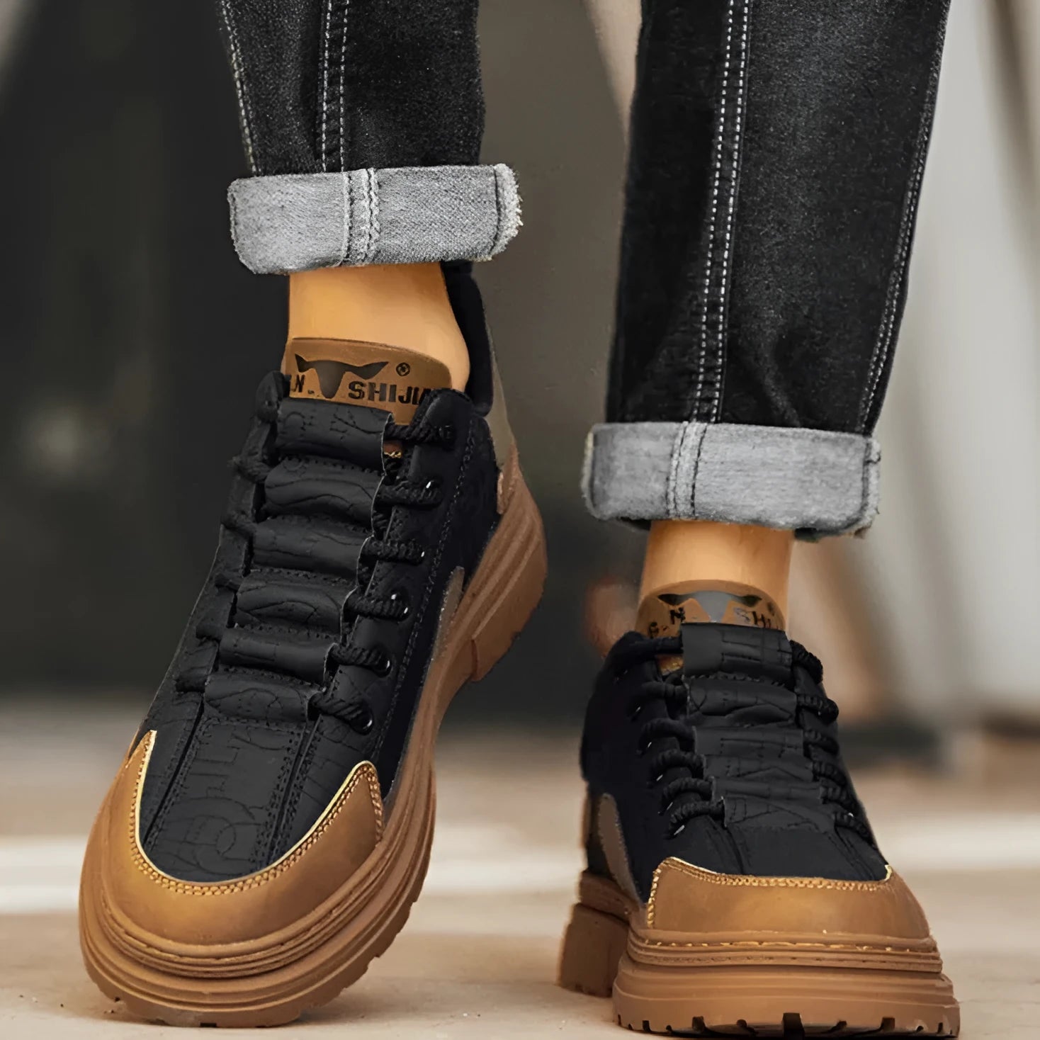 Black and white platform casual sneakers with thick rubber soles and colour-panelled pattern detailing