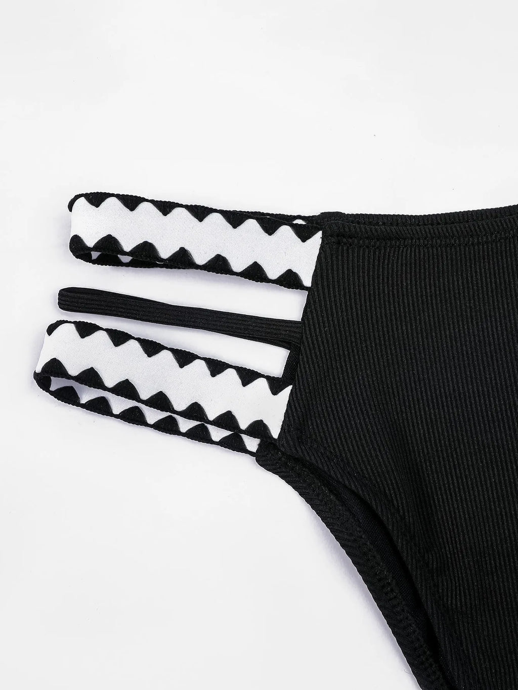Black women's bikini swimsuit with a hollowed-out split design and brief style.