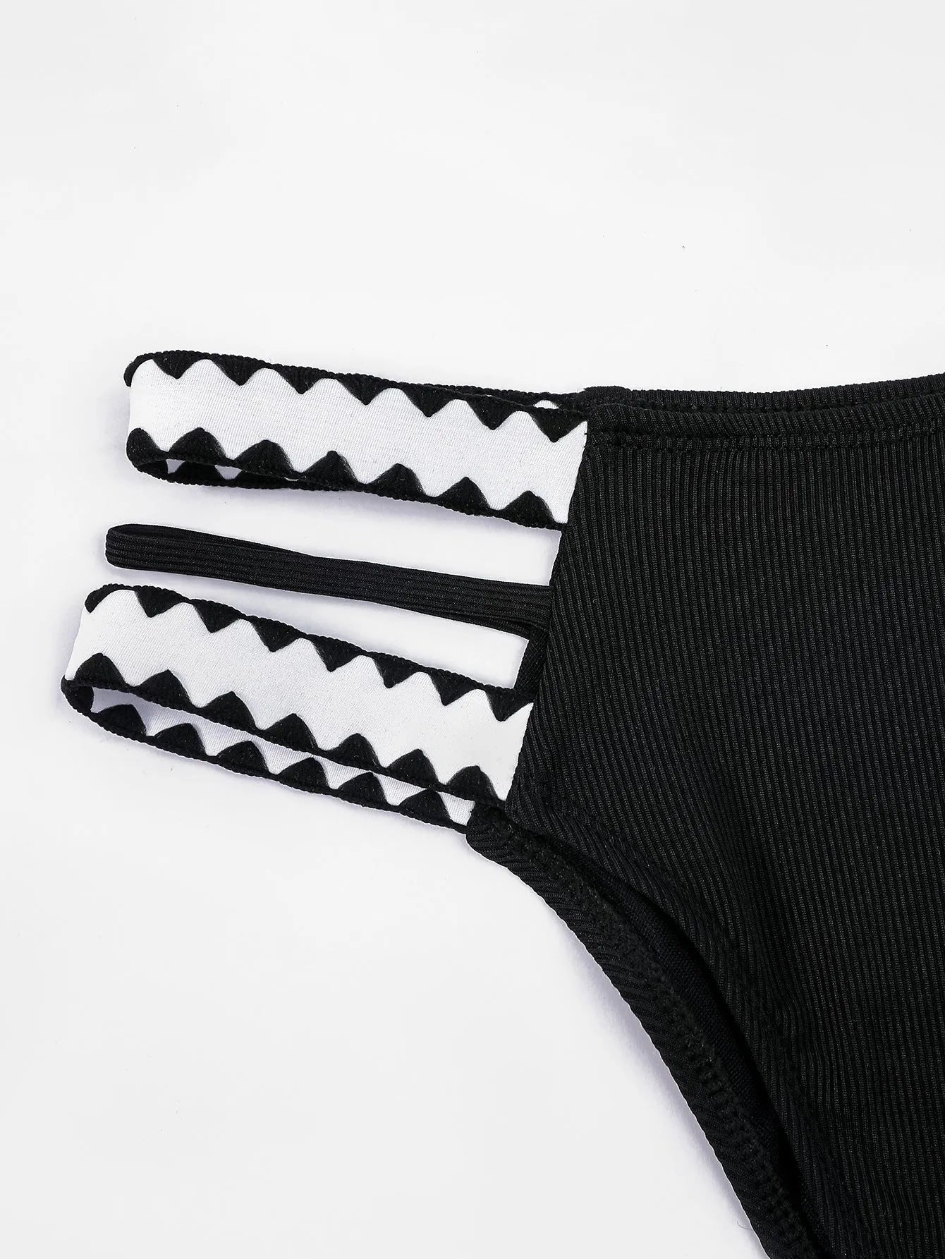 Black women's bikini swimsuit with a hollowed-out split design and brief style.