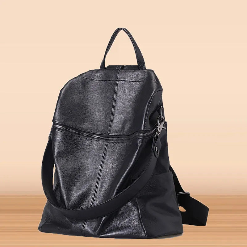Women's genuine leather retro backpack showing internal organisation compartments and sewing thread detailing