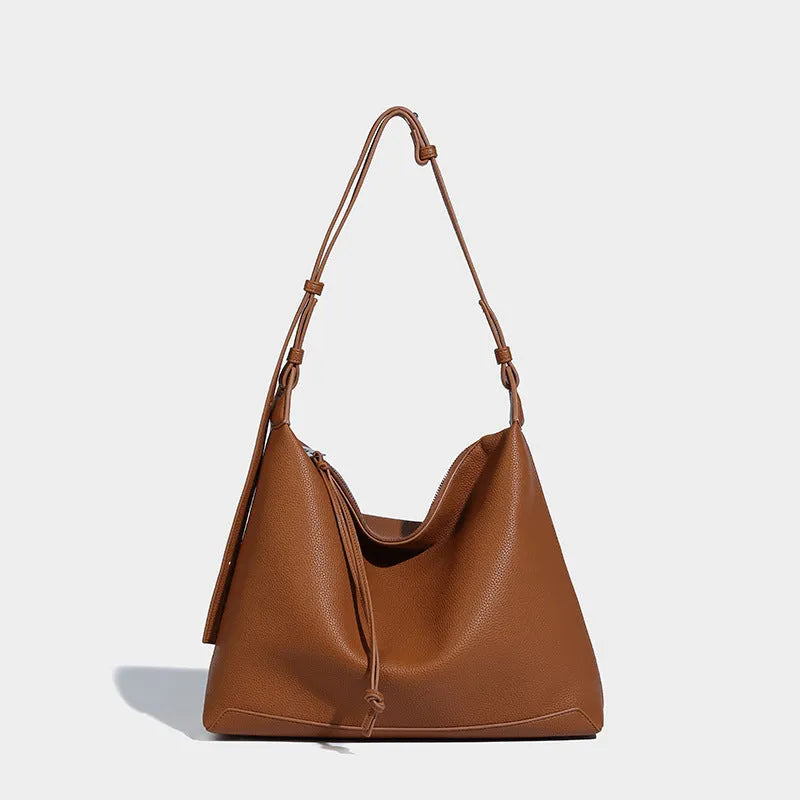 Soft PU messenger bag in caramel colour showing 36cm length and underarm shoulder strap