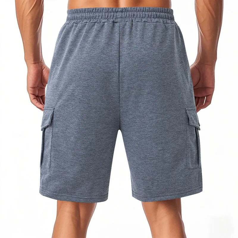 Heavy loose fit light gray cargo sports shorts made from terry fabric with multiple pockets.