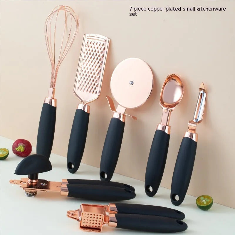 Seven-piece stainless steel kitchen tool set with rose gold finish and copper plating elements