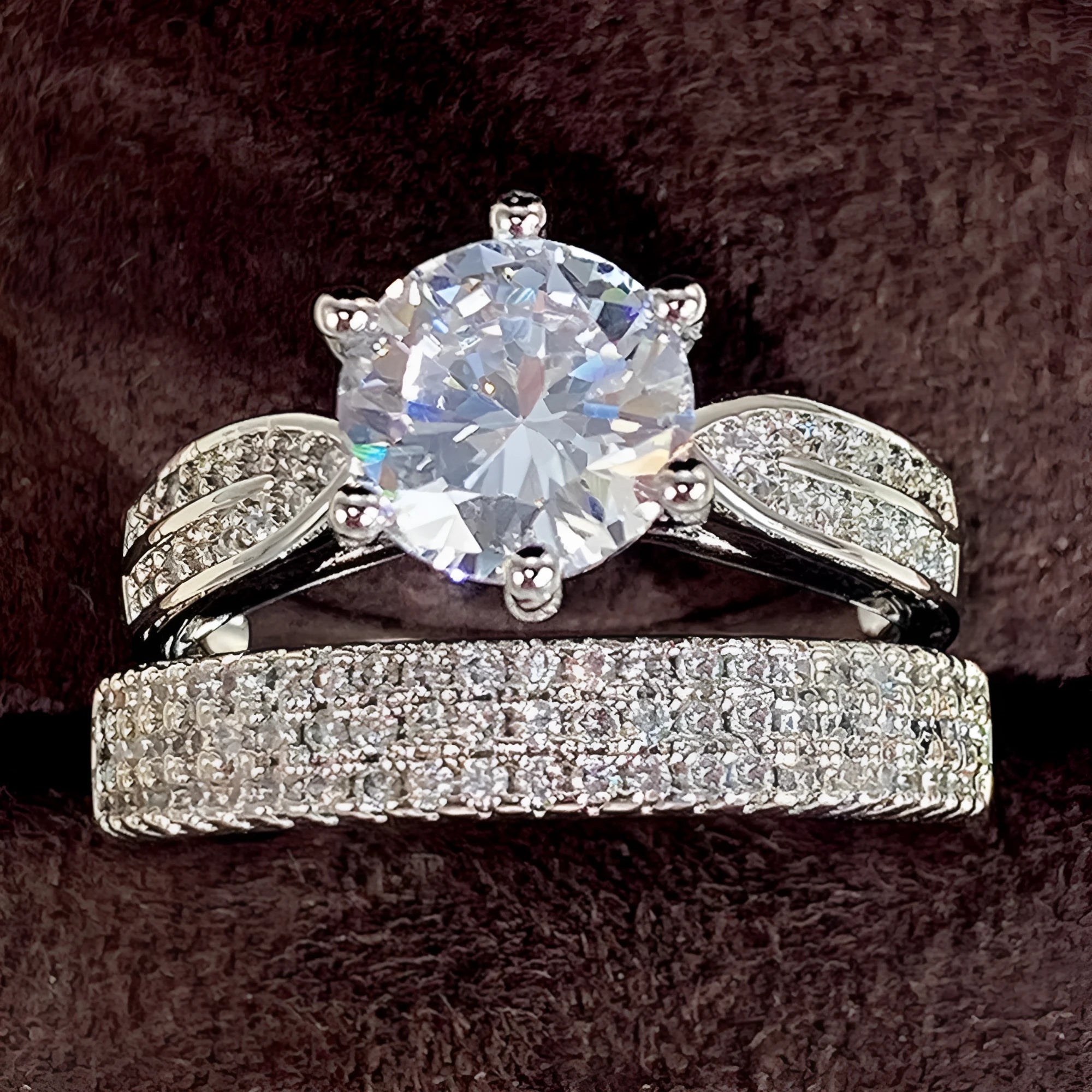 White gold colour alloy combined ring and bracelet with geometric shape and round details.