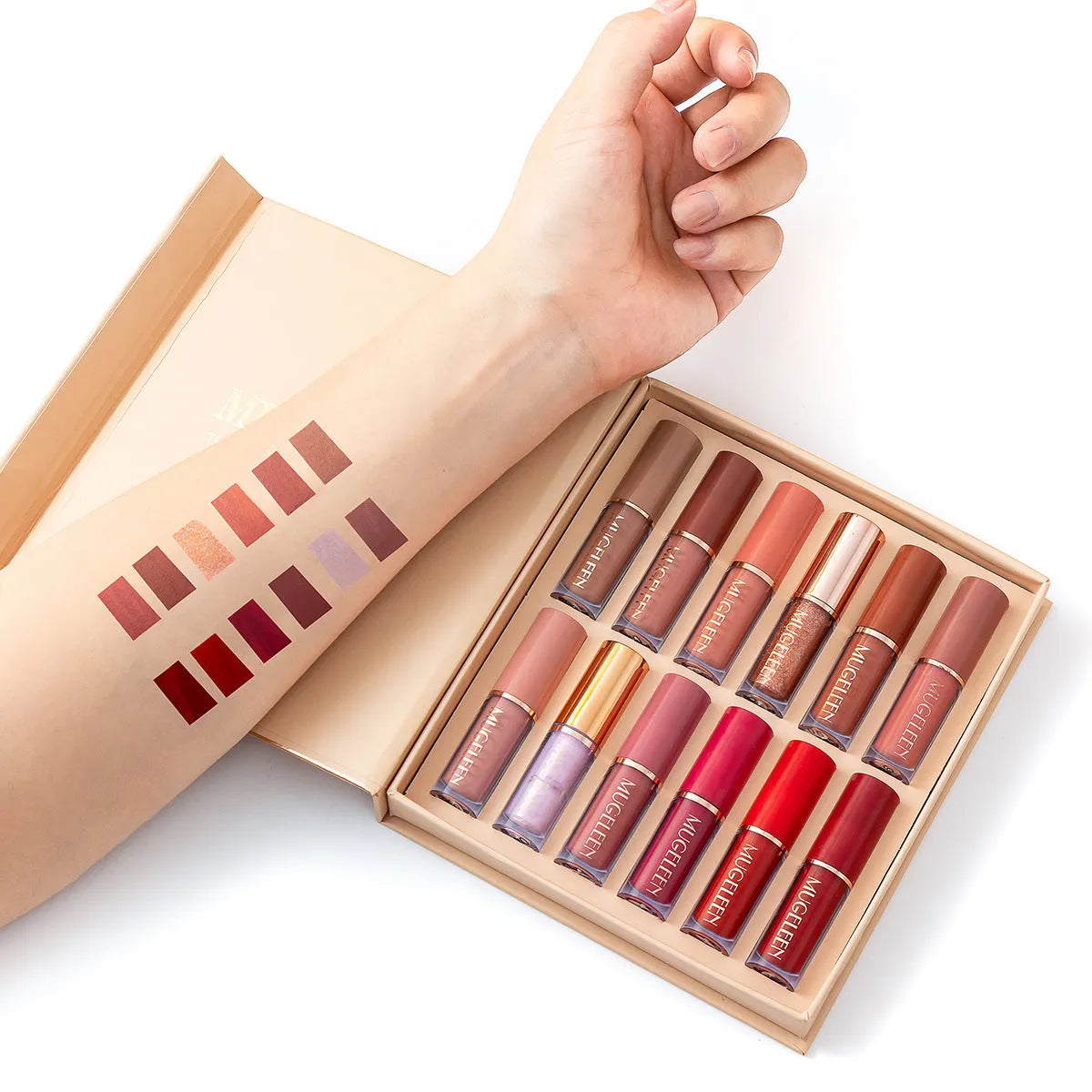 Boxed set of 12 matte shimmer lip glazes in various shades on a pink background.