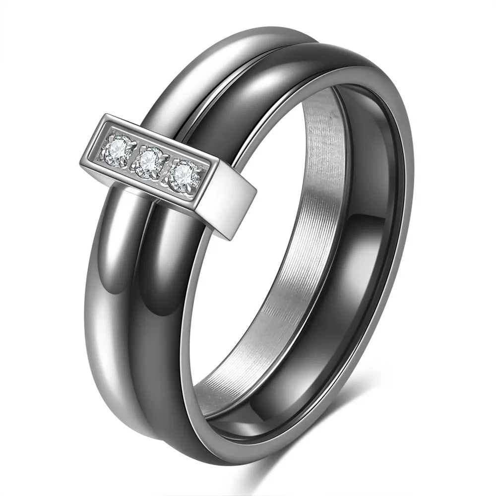 Geometric ceramic women's ring with glossy stitching and inlaid zirconium detail, shown in steel black.