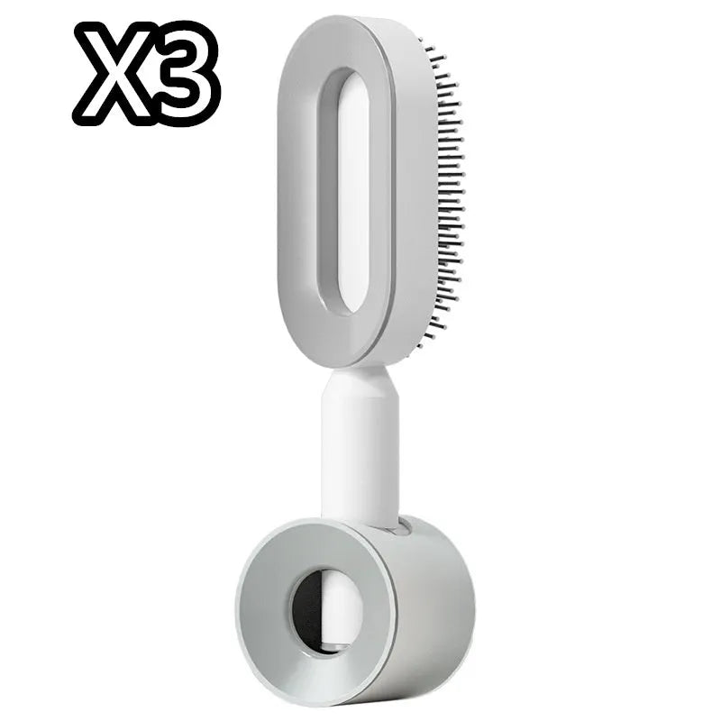 Self-cleaning air cushion hair brush in white, black gold, or black purple with ergonomic handle