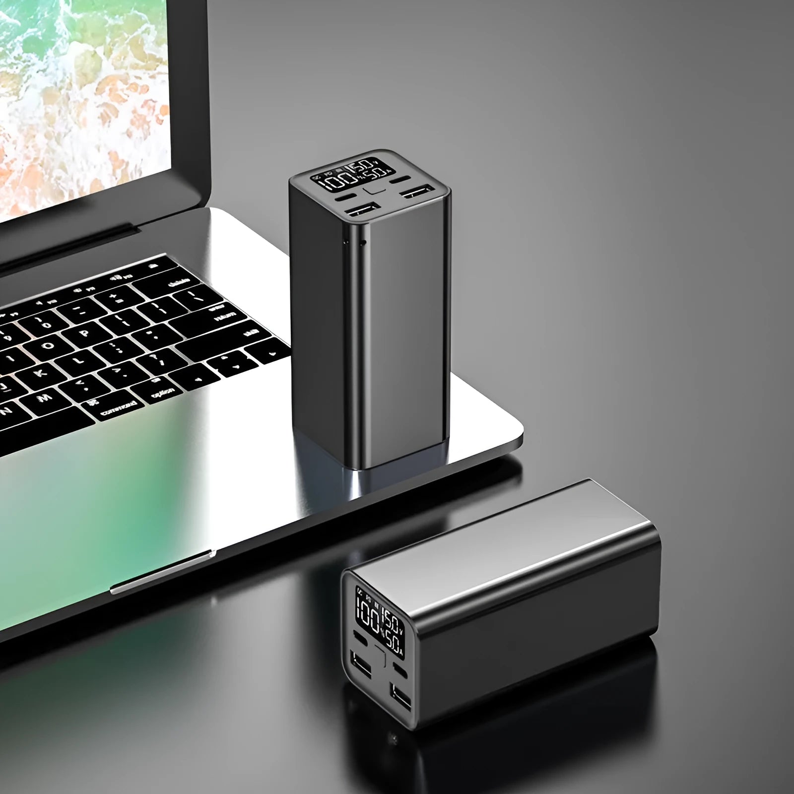 Black aluminium alloy 65W power bank with 20000mAh capacity for laptop charging, shown next to a charging cable.