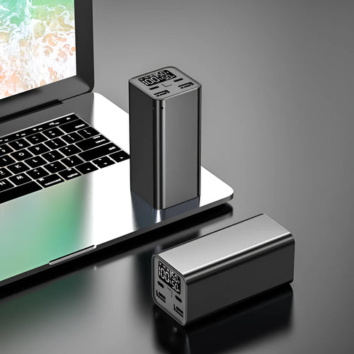 Black aluminium alloy 65W power bank with 20000mAh capacity for laptop charging, shown next to a charging cable.