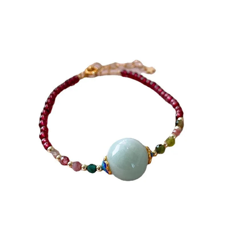 Women's Chinese style bracelet with garnet colour, drop-shaped tourmaline stones and electroplated finish
