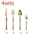 Stainless steel cutlery set with gold finish including knife, fork, spoon, and teaspoon on table