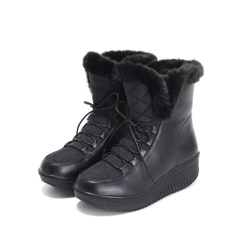 Black women's lace-up winter boots with 3cm platform sole on a neutral background