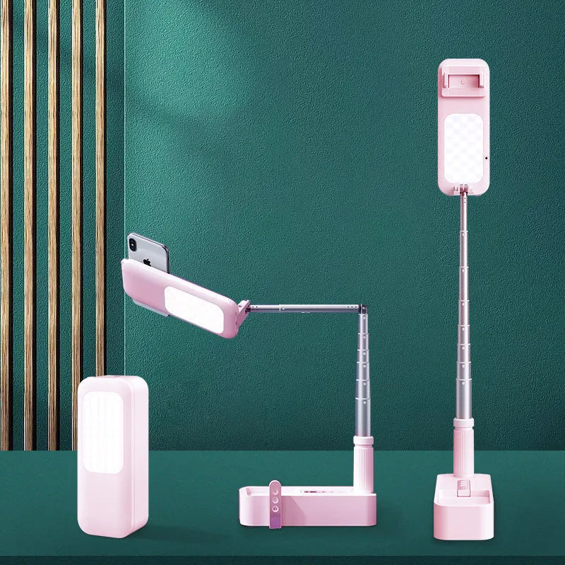 Wireless live broadcast bracket fill light retractable stand for smartphone in white, shown on a desk with a phone mounted.