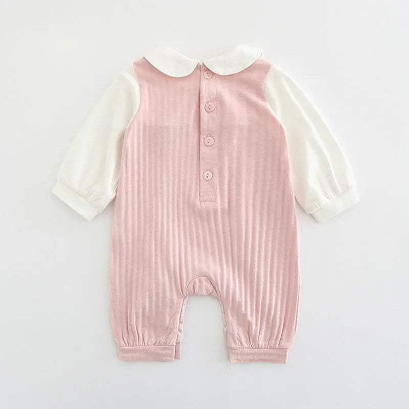 Pink embroidered cotton baby girl jumpsuit with long sleeves and single-breasted closure