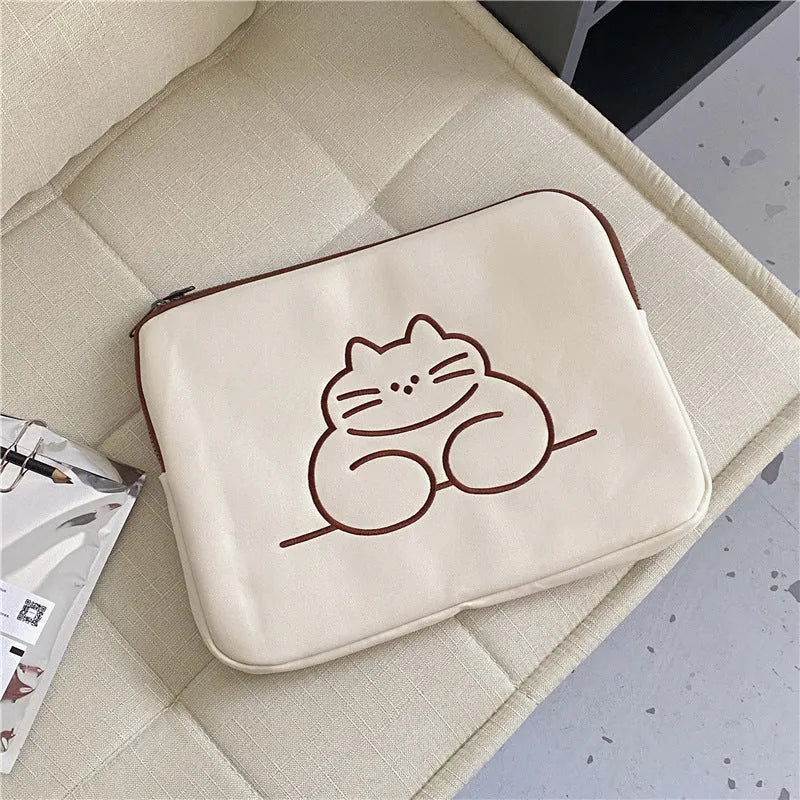 Embroidered animal design on a nylon protective sleeve bag for tablets with a zipper.
