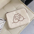 Embroidered animal design on a nylon protective sleeve bag for tablets with a zipper.