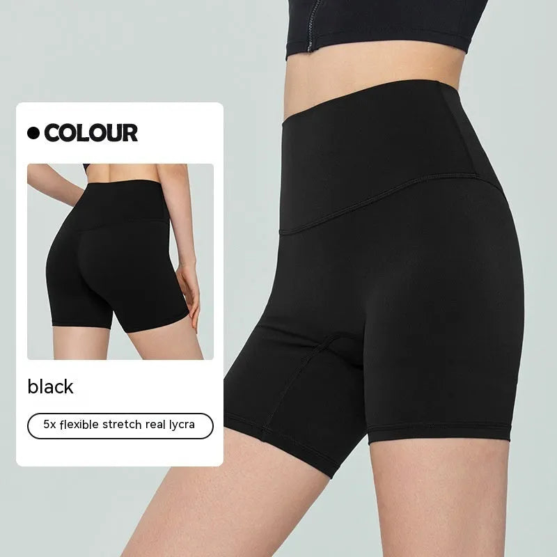 Woman wearing leaf green high waist Lycra yoga shorts for fitness exercise.