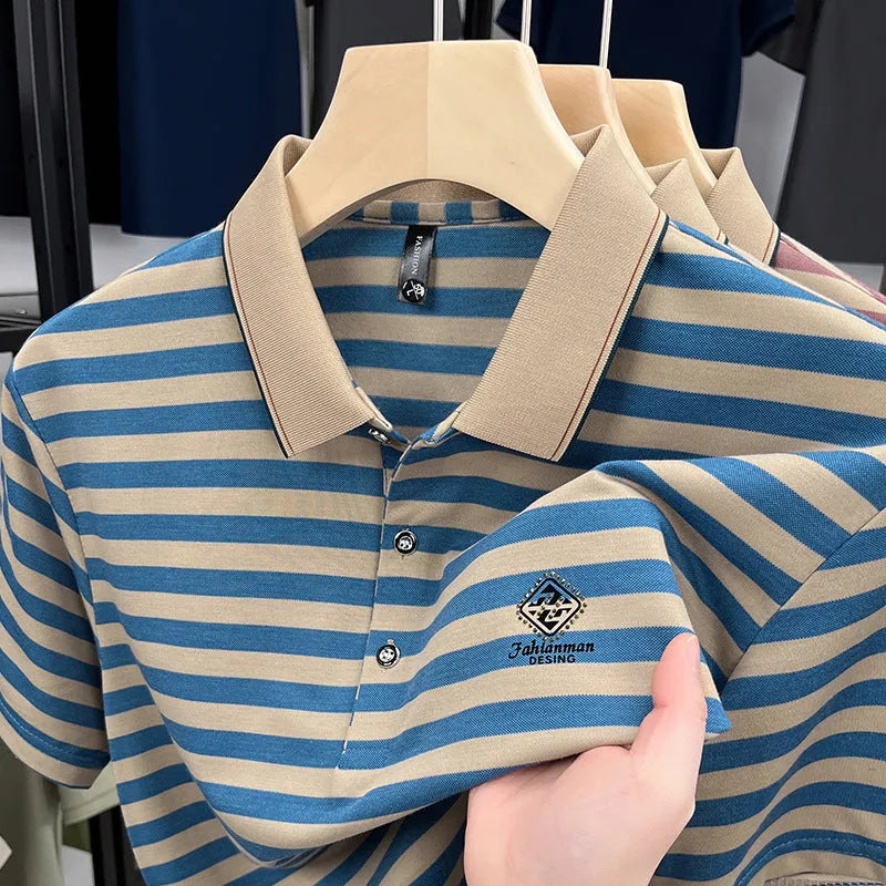 Man wearing a red and blue striped short sleeve casual shirt with a mosaic pattern.