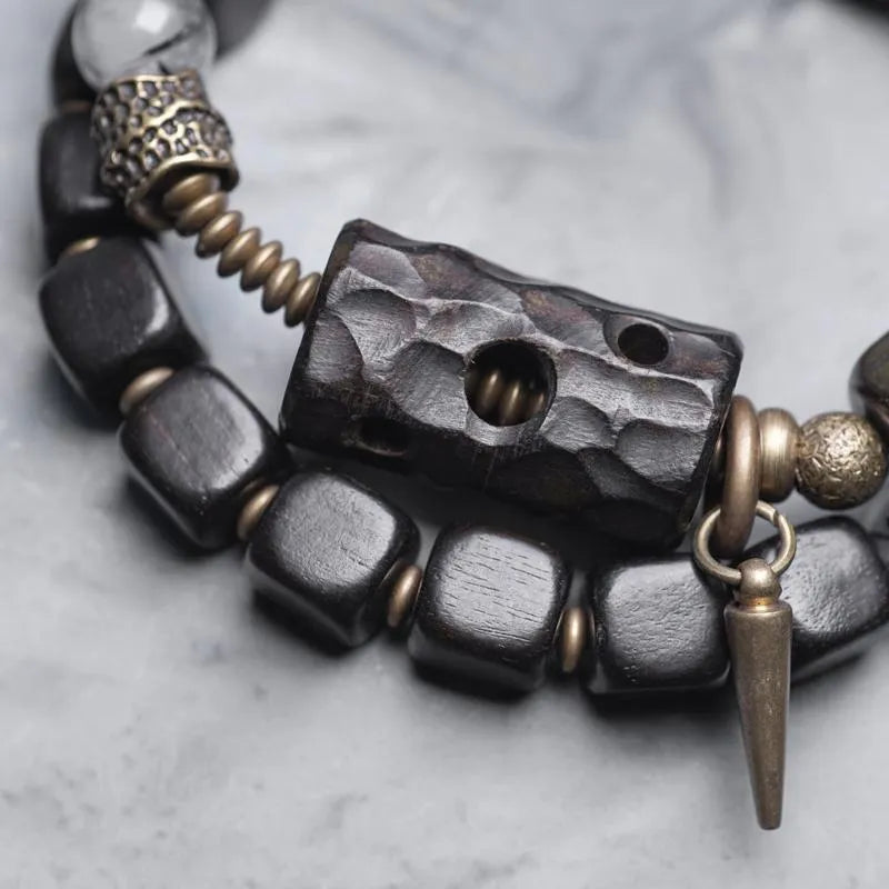 Ethnic style black hair crystal mixed handmade texture bracelet on a neutral background