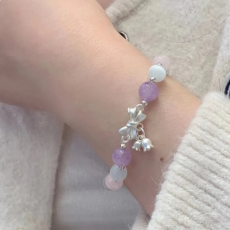 Lavender purple bowknot crystal bracelet with opal elements measuring 10mm