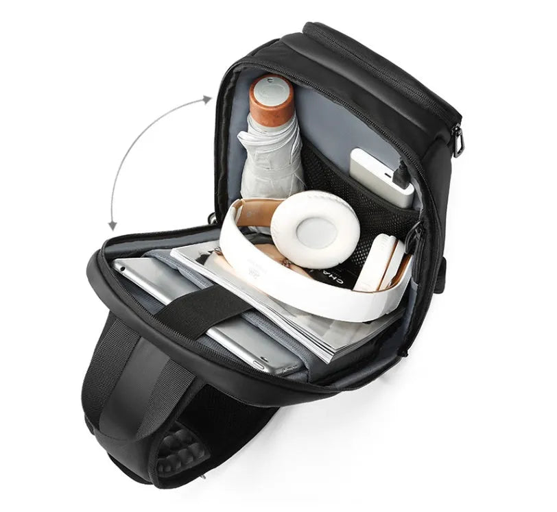 Black PVC outdoor shoulder bag with adjustable strap and internal laptop compartment