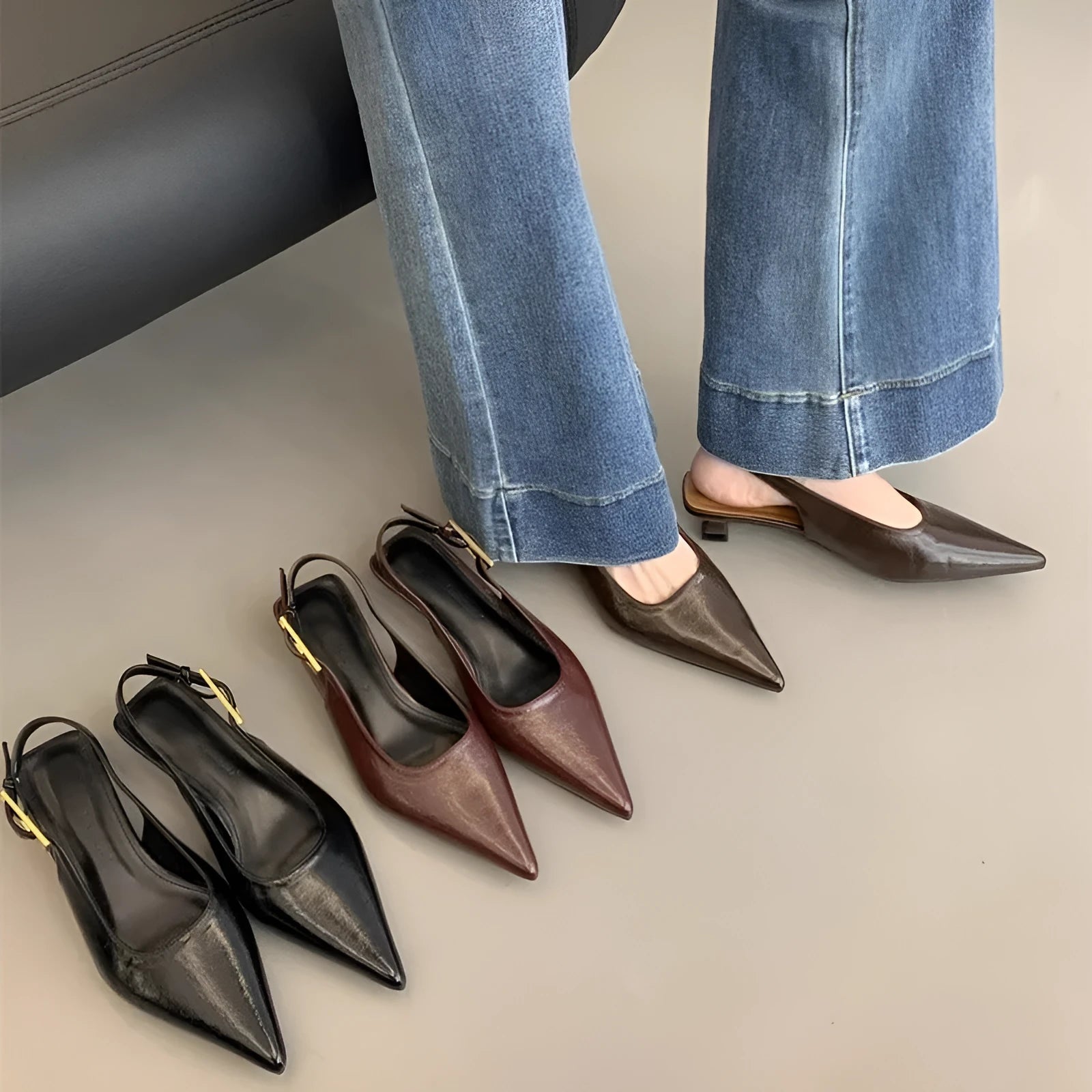 Thin low heel strap pointed leather shoes in black, red, brown, or silver on a rubber sole.