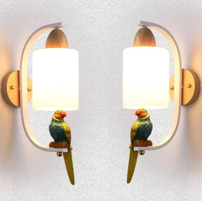 Resin bird wall lamp with iron body, wood accent, and glass lampshade on a wall