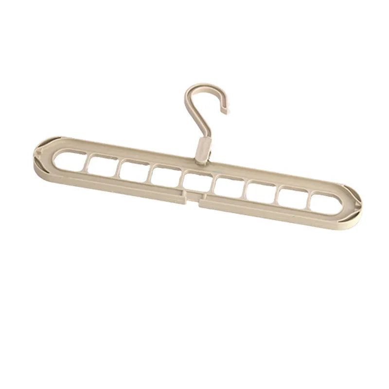 Plastic nine-hole folding clothes hanger for trousers in green, blue, pink, beige, and grey colour options.