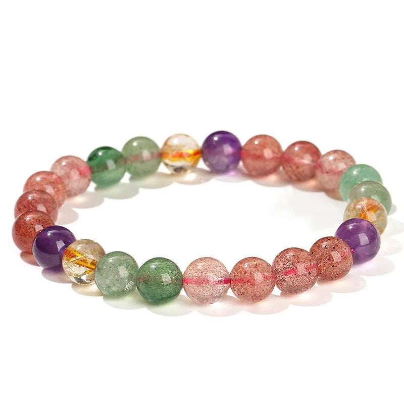 Natural tourmaline colour strawberry quartz bracelet with geometric round beads on a wrist.