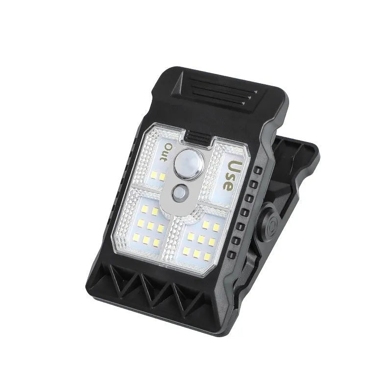 Compact black ABS clip lamp with motion sensor for automatic lighting in workshops.