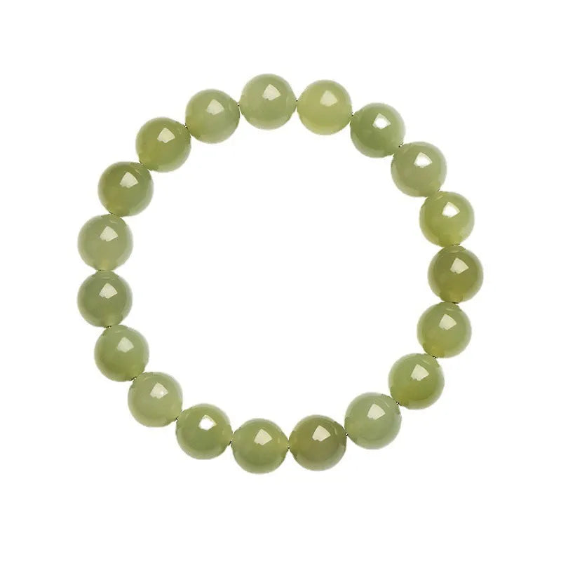 Polished Hetian jade ball bracelet showing different bead sizes on a wrist, in clear ice-like colours.