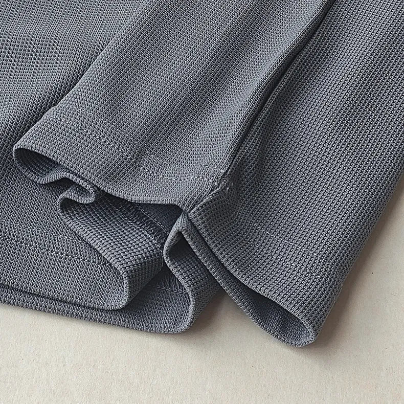 Men's heavyweight waffle-knit short-sleeved t-shirt in a solid colour, showing textured fabric detail.
