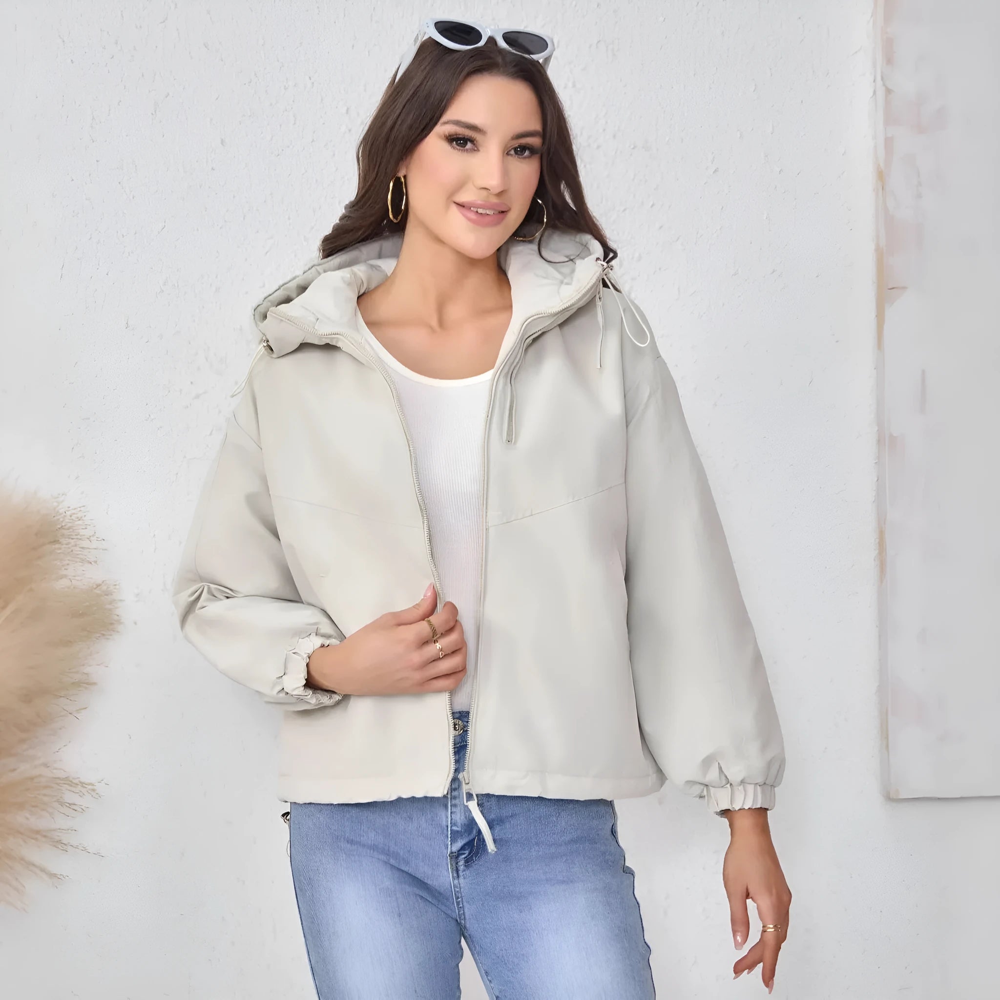 Women's grey hooded loose-fit polyester shell jacket with long sleeves